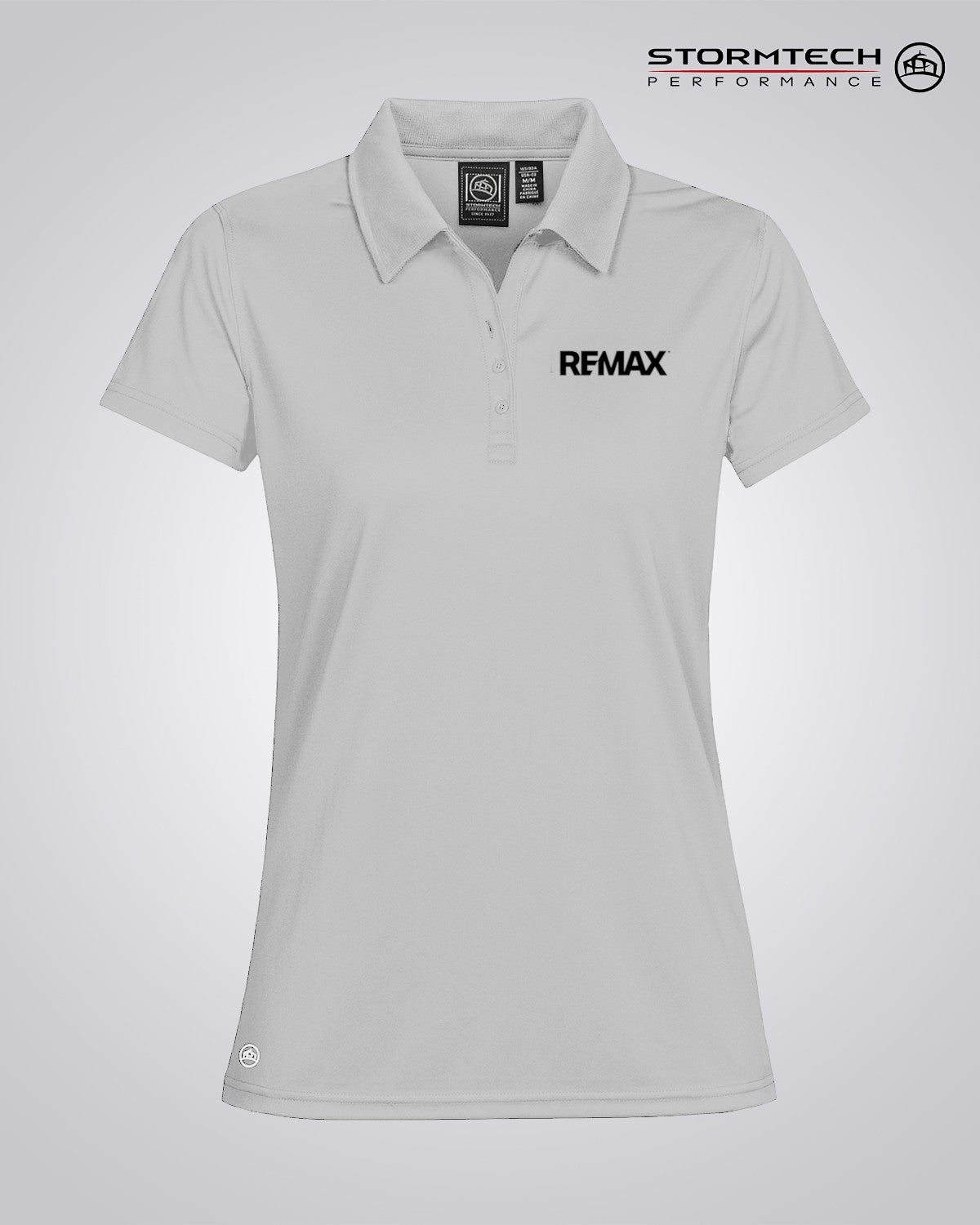 A light gray women's short-sleeve polo shirt with a black REMAX logo on the left chest, displayed on a neutral light gray background with the Stormtech Performance logo in the top right corner.