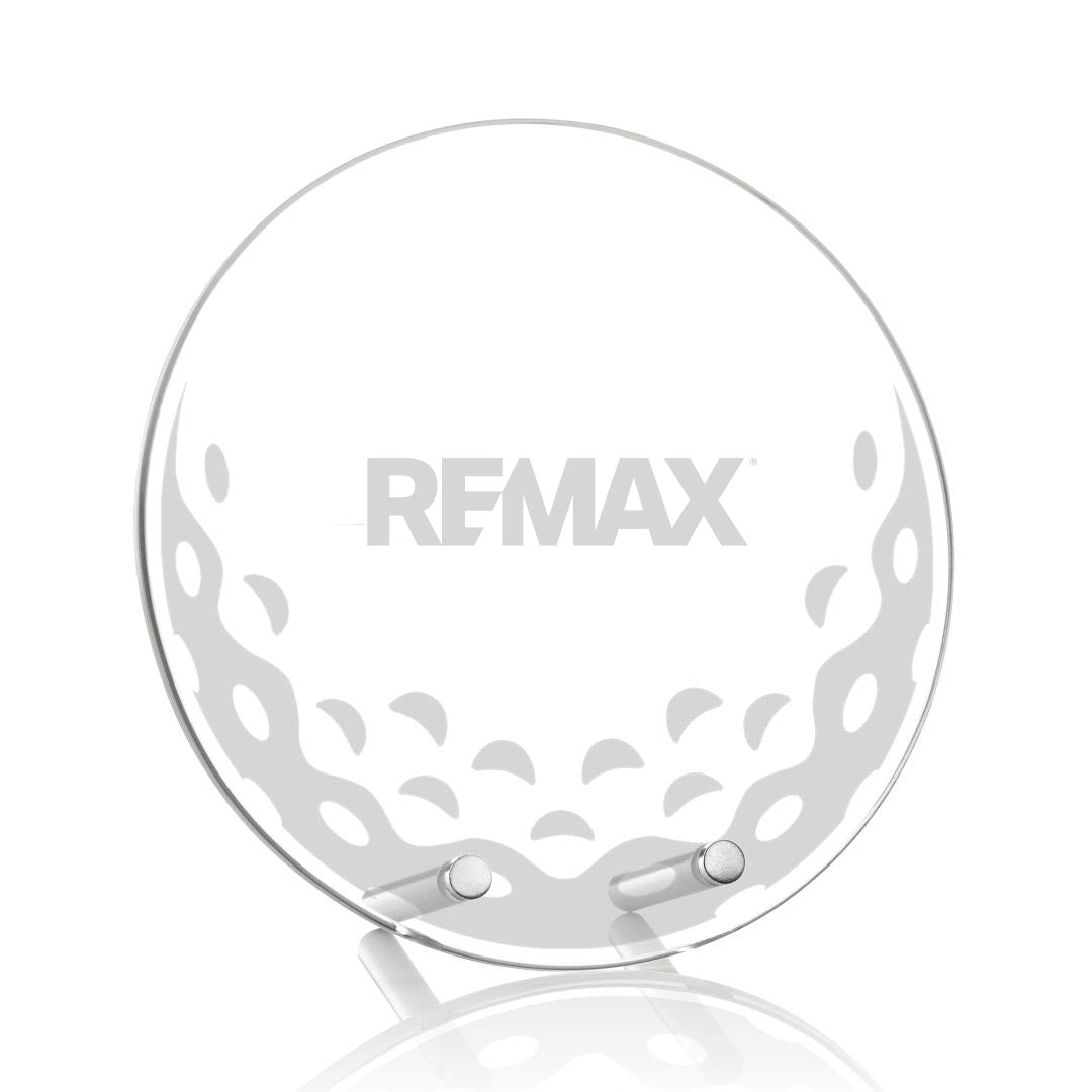 Clear golf ball with 'REMAX' branding on a white background