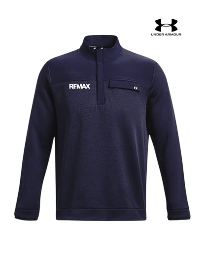 A navy blue Under Armour quarter-zip pullover sweatshirt with a white 'REMAX' logo on the left chest and a small Under Armour logo on the chest pocket, shown on a plain white background with a brand logo overlay in the top right.