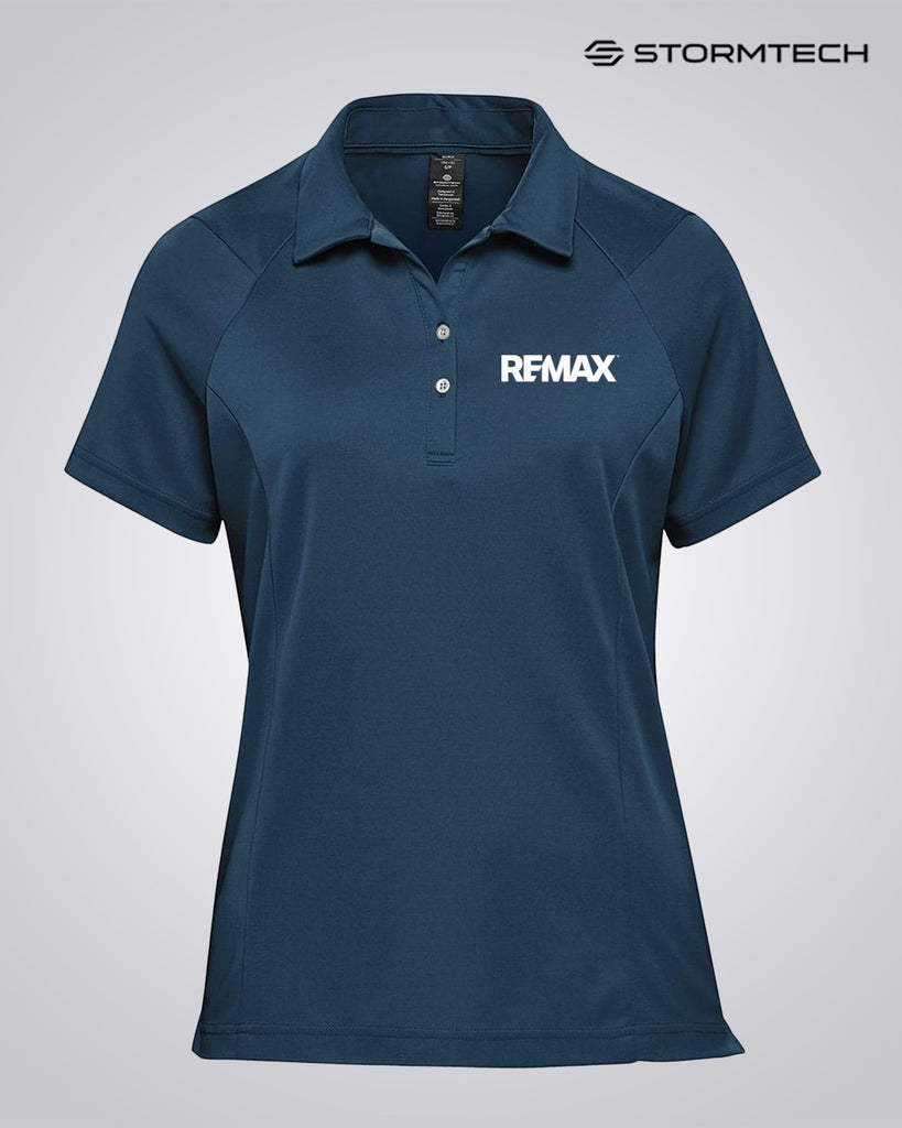A dark blue short-sleeve polo shirt with a collar and two-button placket, featuring the white REMAX logo on the left chest. The Stormtech brand logo is visible in the top right corner.