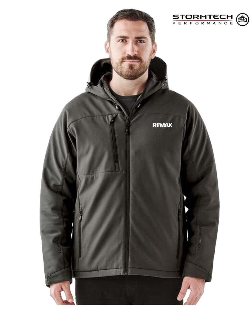 Man wearing a black jacket with REMAX logo on a white background, featuring Stormtech branding.