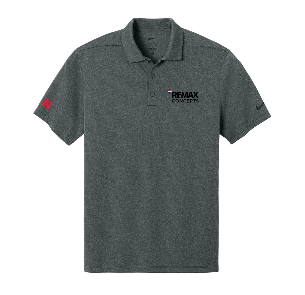 A dark heather gray short-sleeve polo shirt with a collar and two-button placket. The left chest features the black 'REMAX CONCEPTS' logo, the right chest has a small black Nike swoosh, and the right sleeve has a red Nike swoosh.