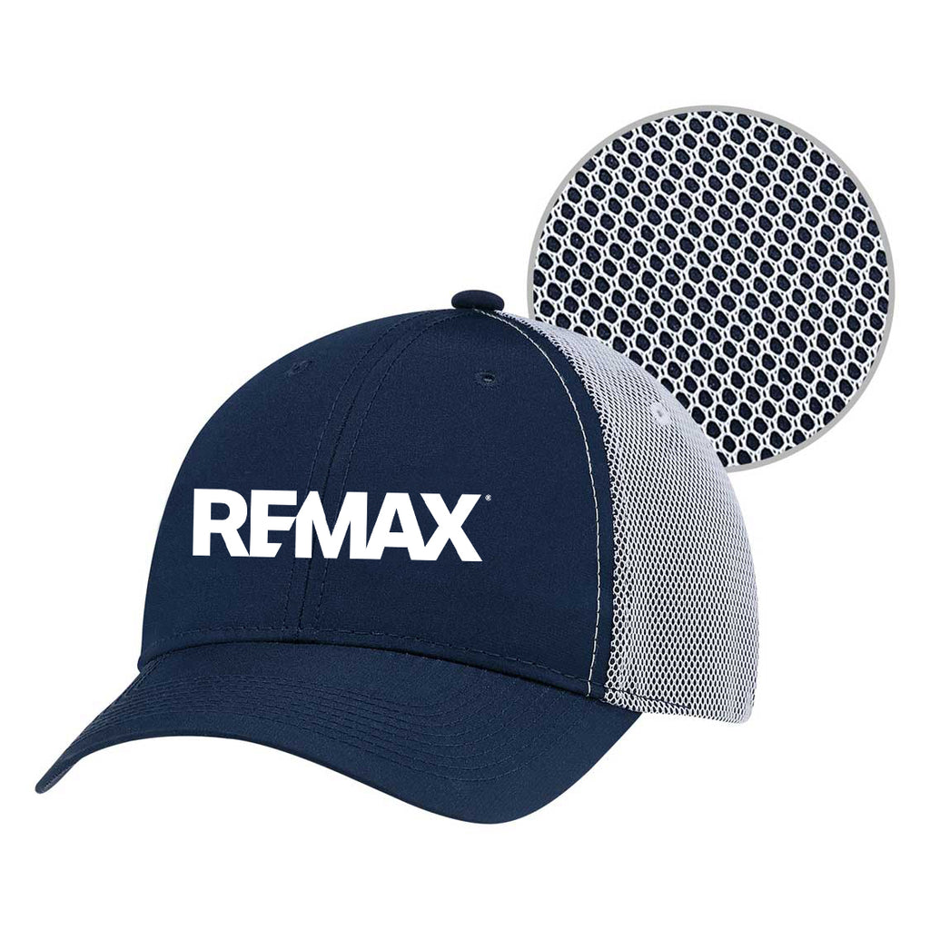 A navy blue and white REMAX trucker-style baseball cap with a circular inset showing the interior honeycomb-patterned ventilation mesh.