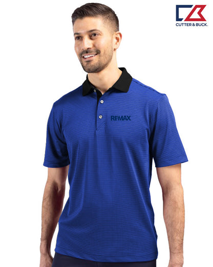 Man wearing a blue polo shirt with REXMAX logo on a white background, featuring the Cutter & Buck brand.