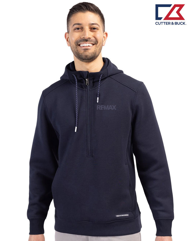 Man wearing a navy hoodie with 'REMAX' logo on a white background, featuring the Cutter & Buck logo.