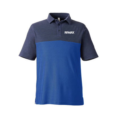 A short-sleeve polo shirt with a color-blocked design, featuring a heathered dark navy upper section and collar, and a solid royal blue lower section. The word 'REMAX' is printed in white on the left chest.