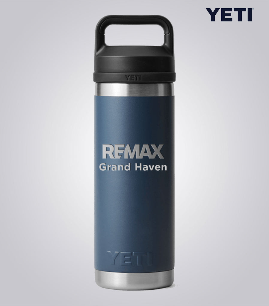 YETI mug with REMAX Grand Haven branding on a gray background