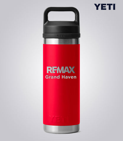 Red YETI bottle with 'REMAX Grand Haven' text on a gray background