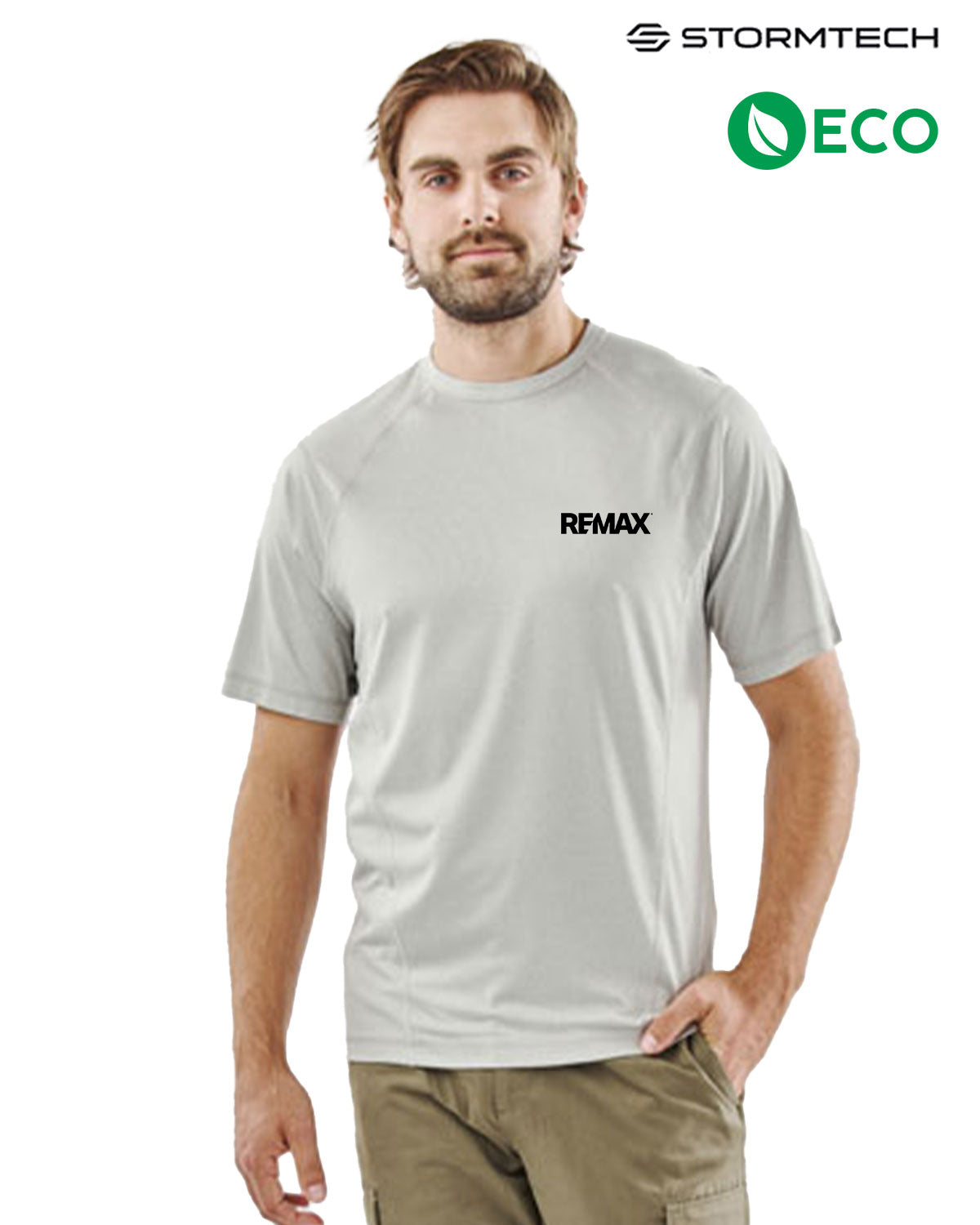 A man wearing a light gray short-sleeve athletic t-shirt with a black 'REMAX' logo on the chest, paired with khaki cargo pants. The background is solid white, with 'STORMTECH' and 'ECO' logos displayed in the top right corner.
