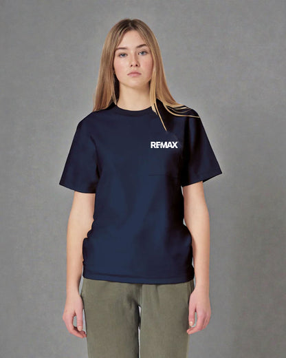 A woman modeling a navy blue short-sleeve t-shirt with a white 'REMAX' logo on the chest, paired with olive green pants, against a neutral gray background.