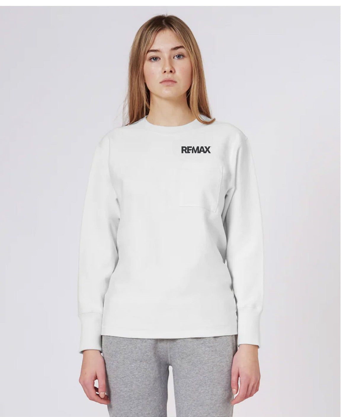 Person wearing a white sweatshirt with 'REMAX' logo on a light gray background