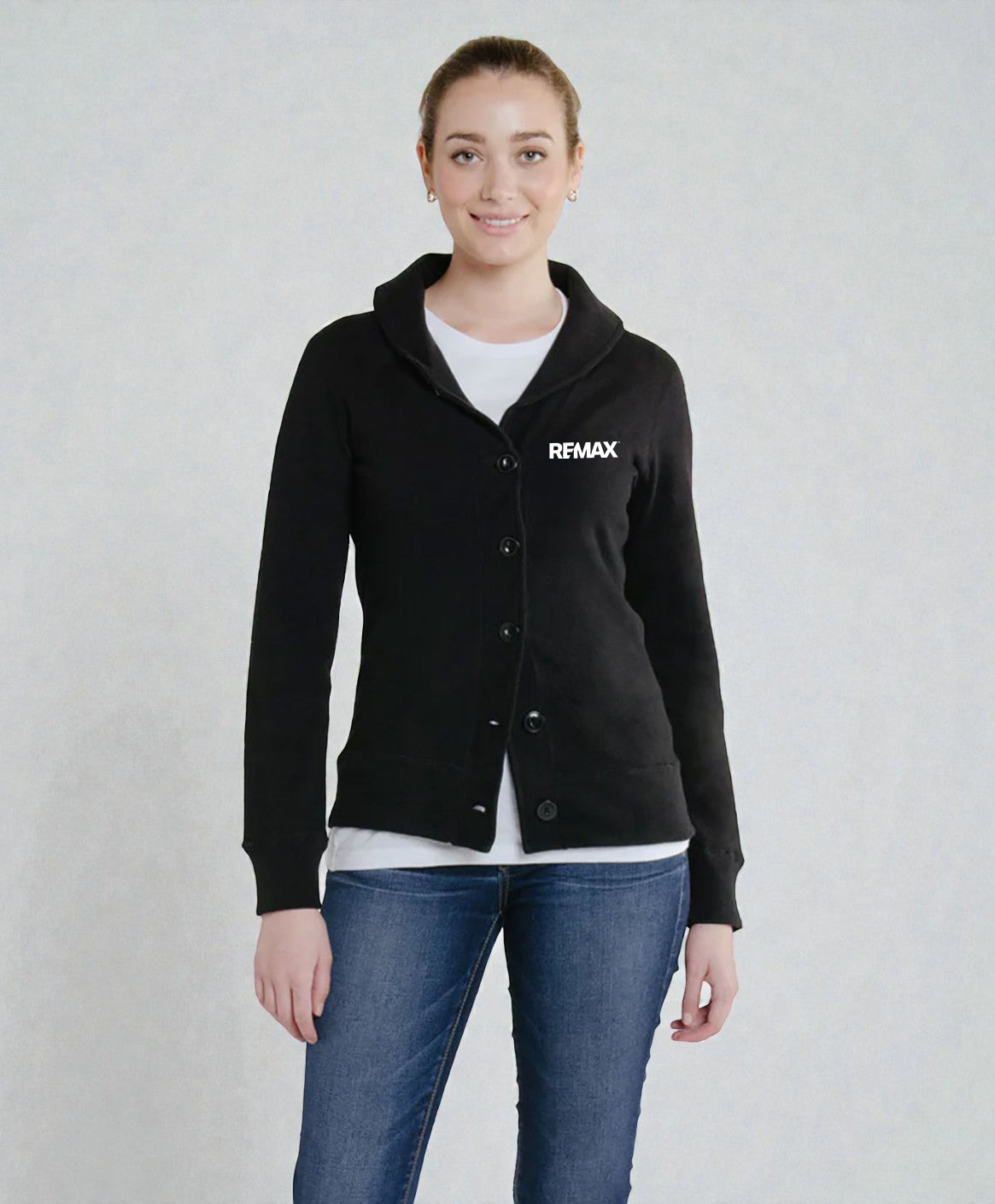 A woman modeling a black long-sleeve button-front cardigan with a hood and a white REMAX logo on the left chest, worn over a white top and blue jeans against a light gray studio background.