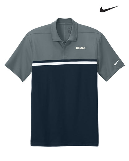 Gray and navy polo shirt with Remax logo and Nike branding on a white background