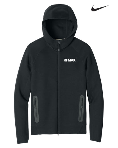 A black Nike REMAX full-zip hooded jacket with two vertical zippered pockets on the lower front and a white Nike swoosh logo in the top right corner, set against a plain white background.