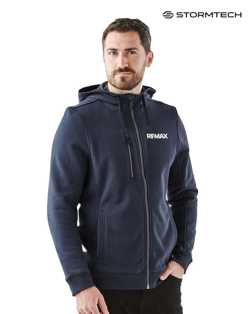 Man wearing a navy blue hoodie with Remax logo, standing against a white background with Stormtech branding.