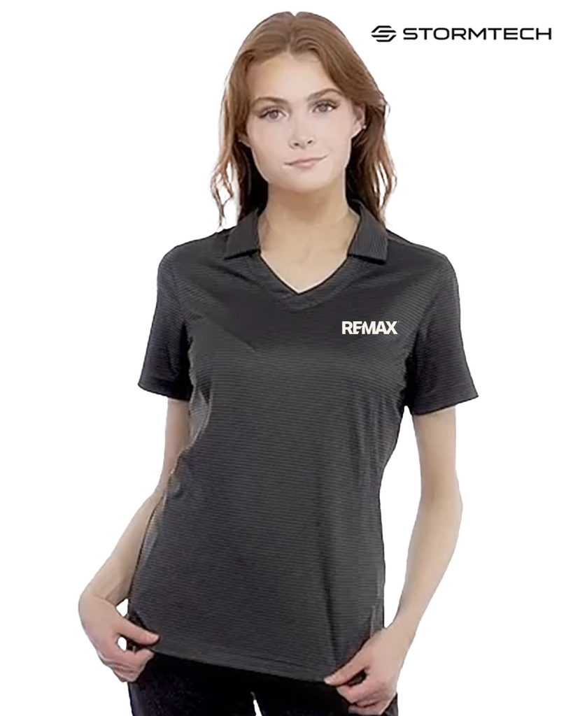 Woman wearing a black polo shirt with 'REMAX' logo on a white background, featuring the Stormtech brand.