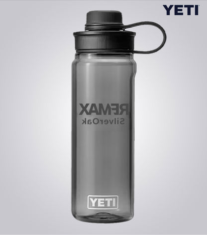 Gray YETI water bottle with 'Rambler' and 'YETI' branding on a light gray background