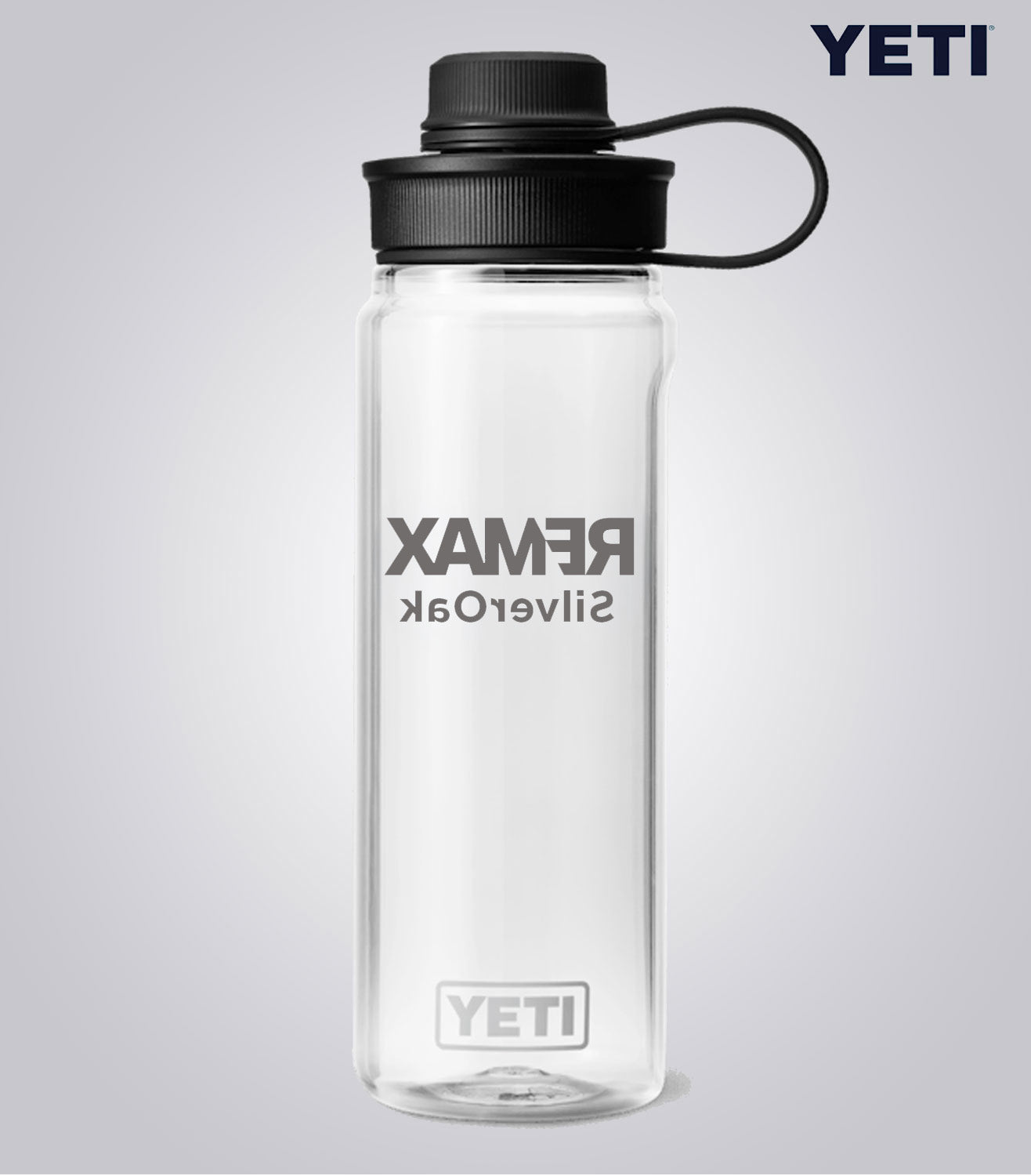 Clear YETI water bottle with black lid on a light gray background