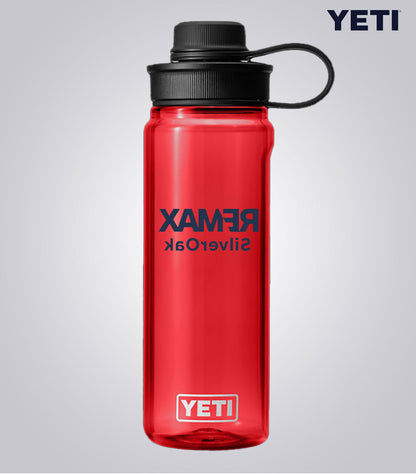 Red YETI water bottle with 'Rambler' text on a gray background