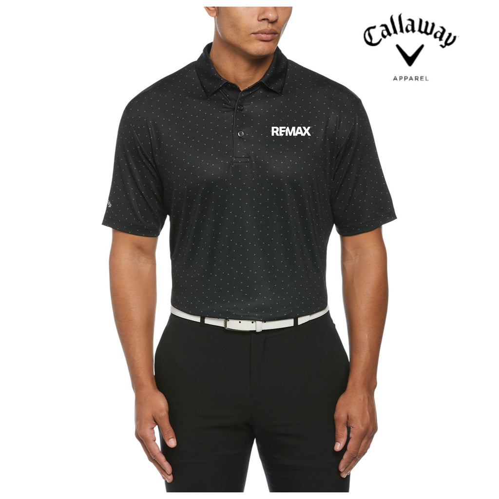 Man wearing a black polka dot polo shirt with 'REMAX' logo and Callaway Apparel branding.