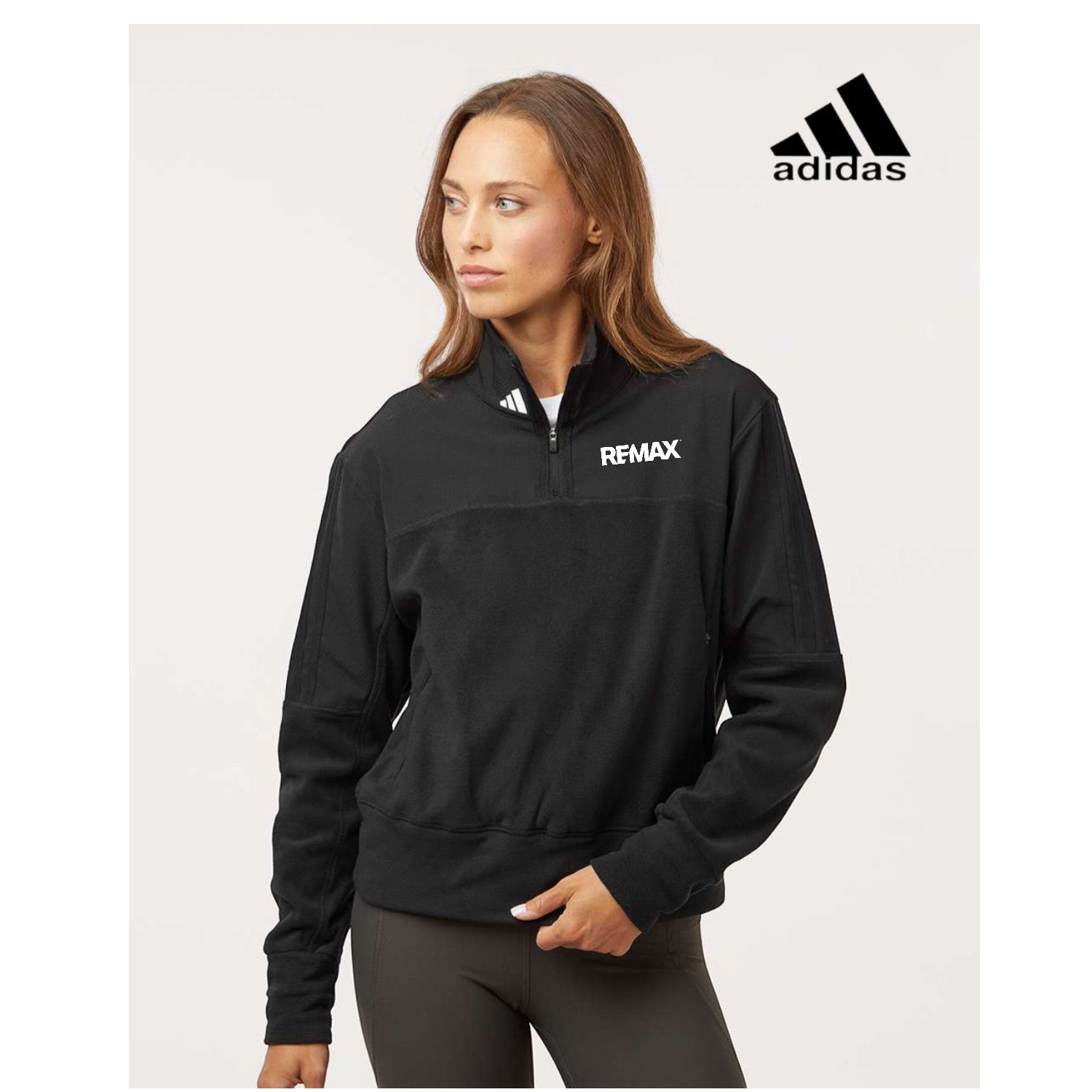 Woman wearing a black Adidas jacket with Remax logo on a white background
