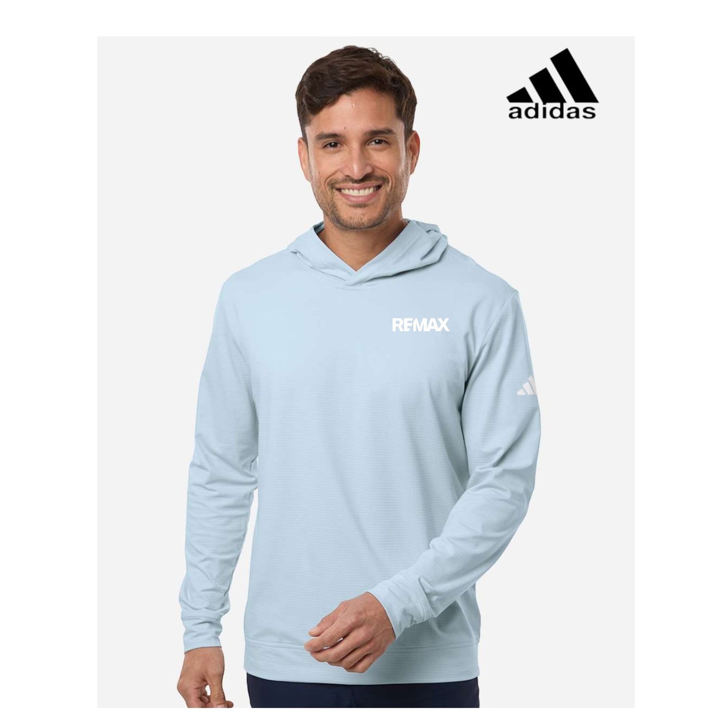 Man wearing a light blue hoodie with Adidas and Remax logos on a white background