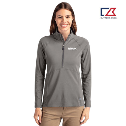 Woman wearing a gray pullover with REMAX logo on a white background, featuring the Cutter & Buck brand.