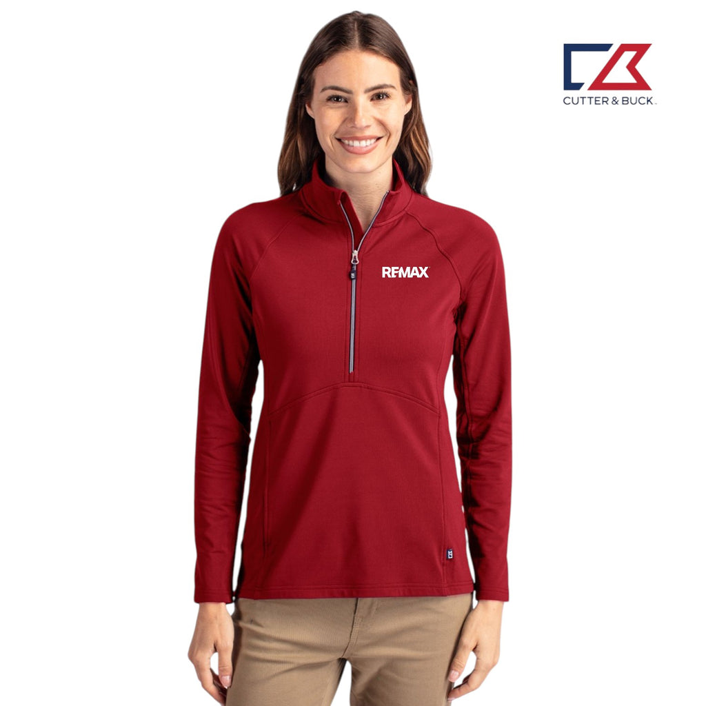 Woman wearing a red jacket with a visible brand logo on a white background