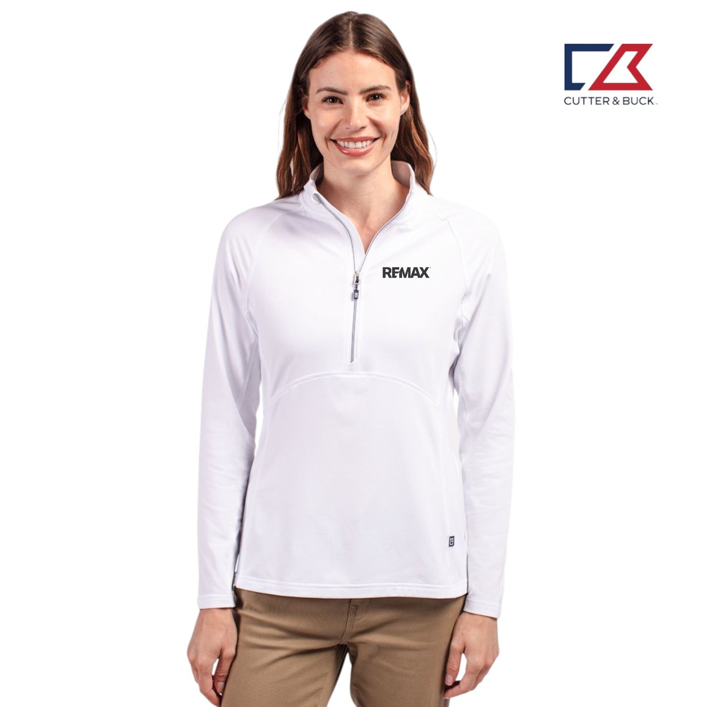 Woman wearing a white zip-up shirt with Remax logo on a white background, featuring Cutter & Buck logo.