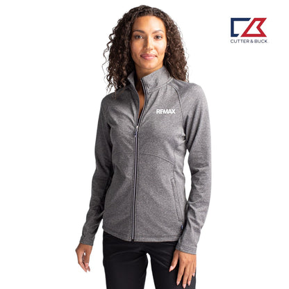 Woman wearing a gray jacket with REMAX logo on a white background, featuring the Cutter & Buck logo.