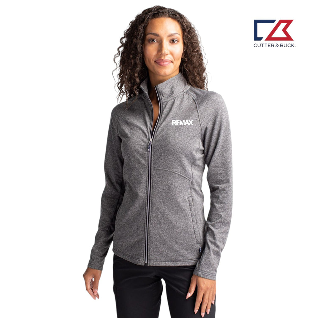 Woman wearing a gray jacket with REMAX logo on a white background, featuring the Cutter & Buck logo.