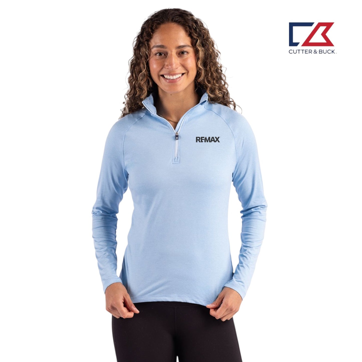 Woman wearing a light blue long-sleeve shirt with Remax logo on a white background