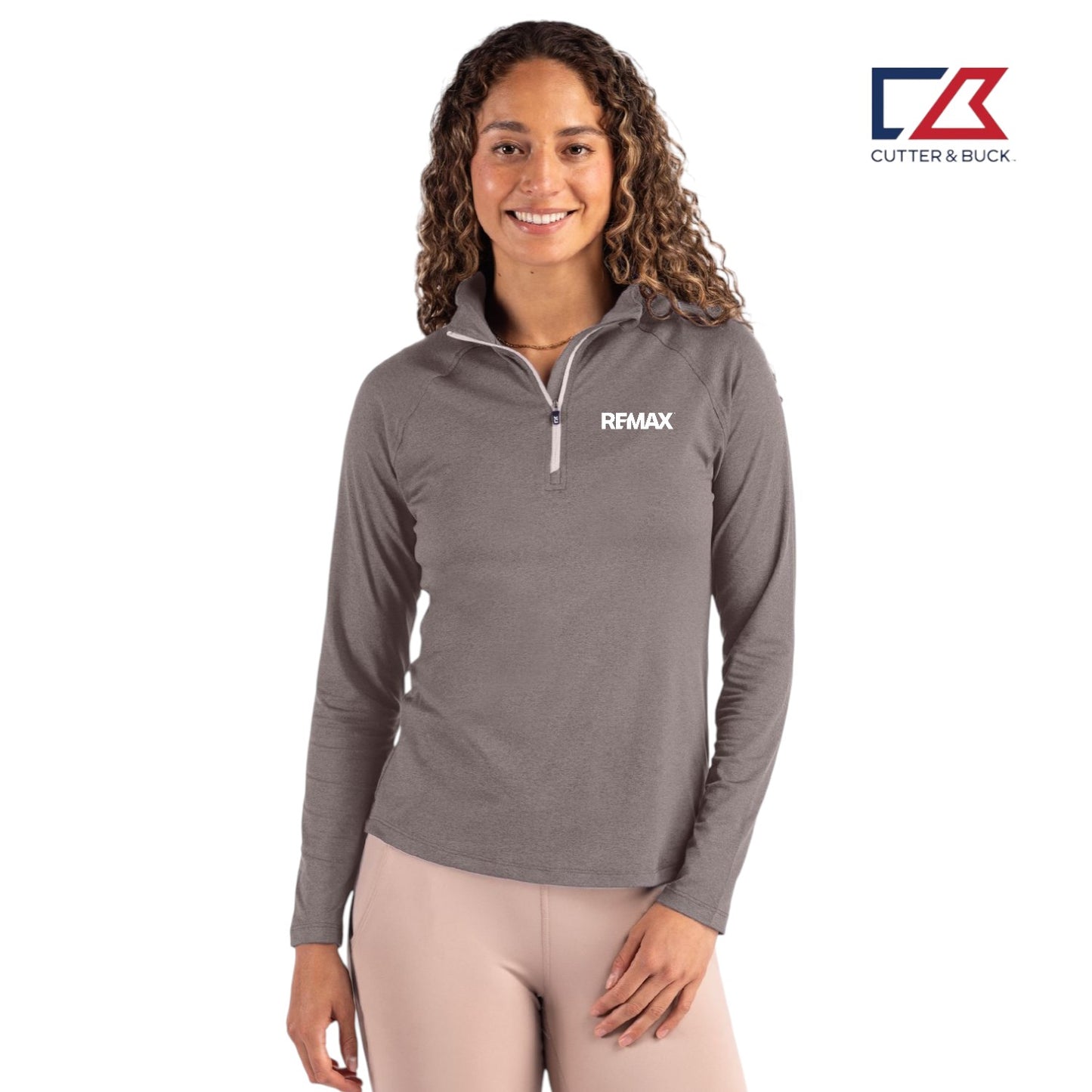 Woman wearing a gray long-sleeve shirt with a Remax logo on a white background