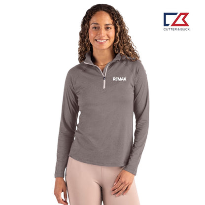 Woman wearing a gray long-sleeve shirt with a Remax logo on a white background