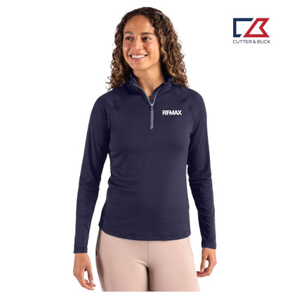Woman wearing a navy long-sleeve shirt with Remax logo on a white background