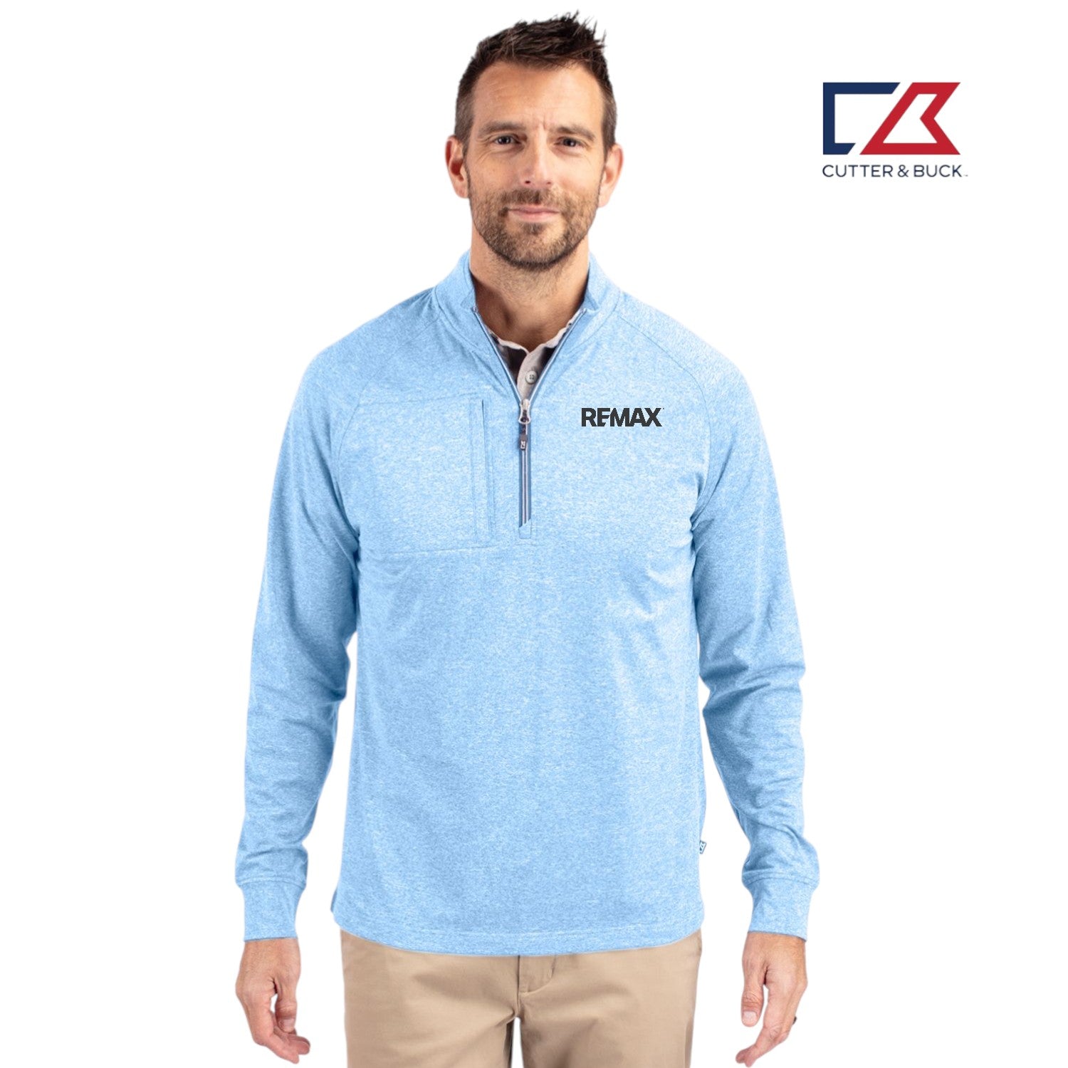Man wearing a light blue pullover with 'REMAX' logo, standing against a white background with Cutter & Buck logo.