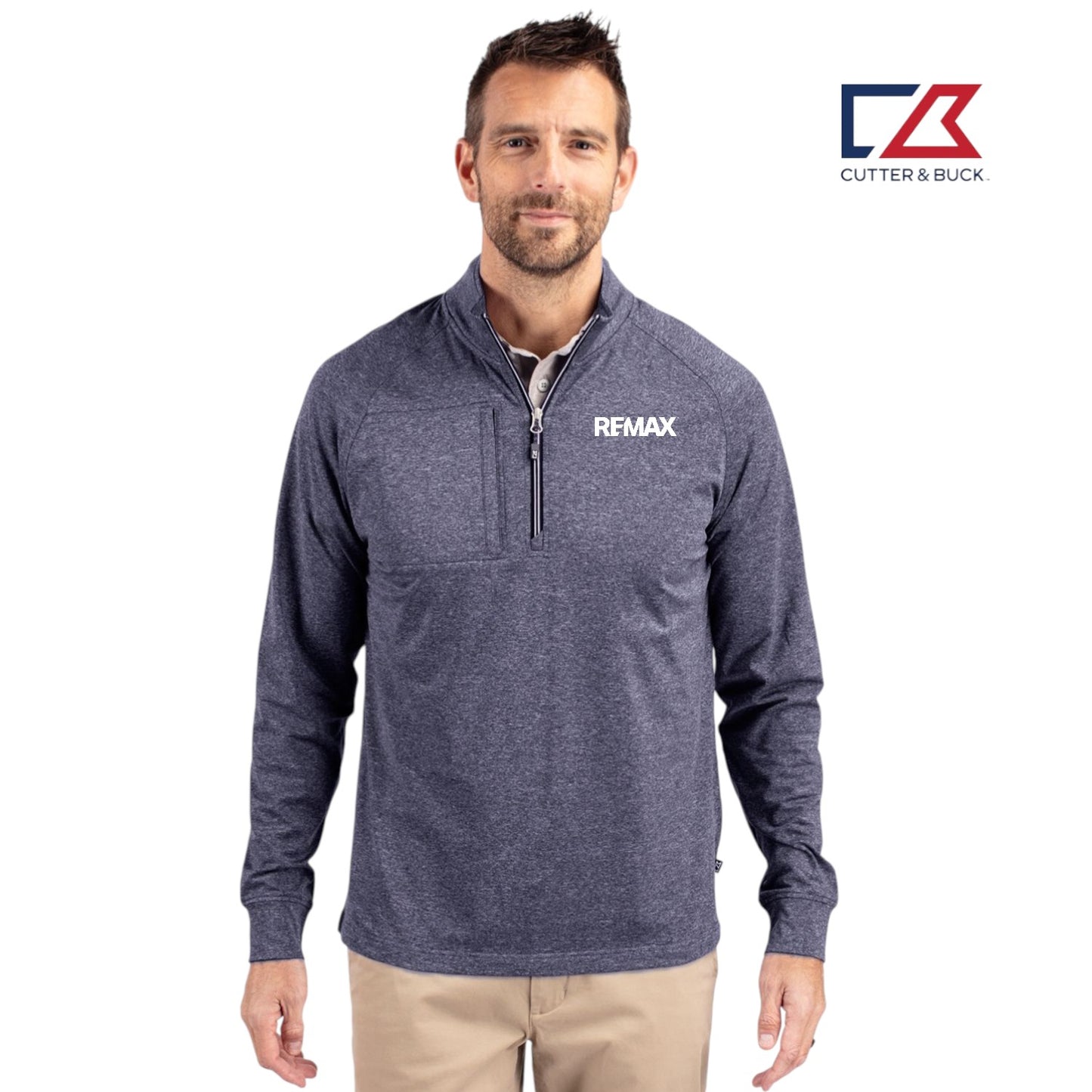 Man wearing a navy blue pullover with 'REMAX' logo, standing against a white background with Cutter & Buck logo.