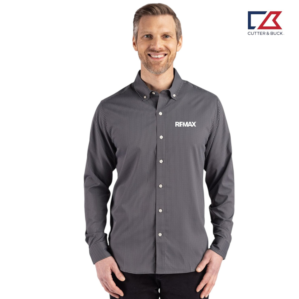 Man wearing a gray patterned shirt with a visible RE/MAX logo on a white background