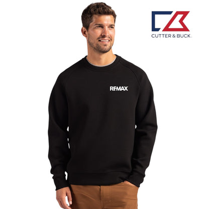 Man wearing a black sweatshirt with 'REMAX' logo, standing against a white background with Cutter & Buck logo.
