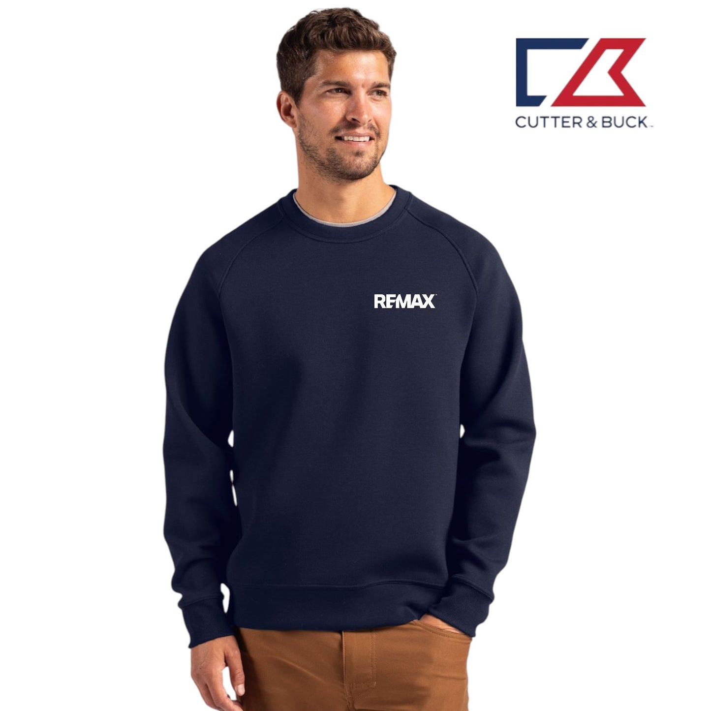 Man wearing a navy sweatshirt with 'REMAX' logo, standing against a white background with Cutter & Buck logo.