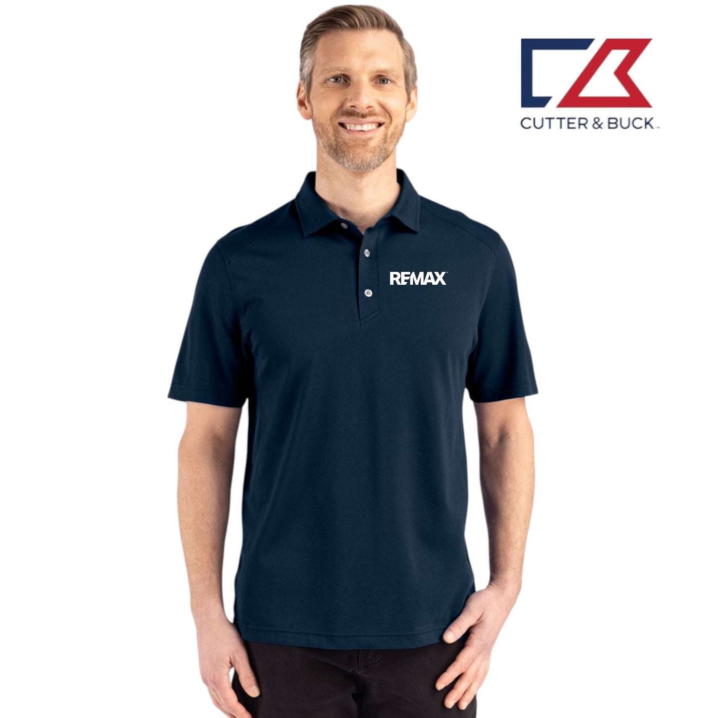 Man wearing a navy blue polo shirt with a logo on a white background, featuring the Cutter & Buck and RE/MAX logos.