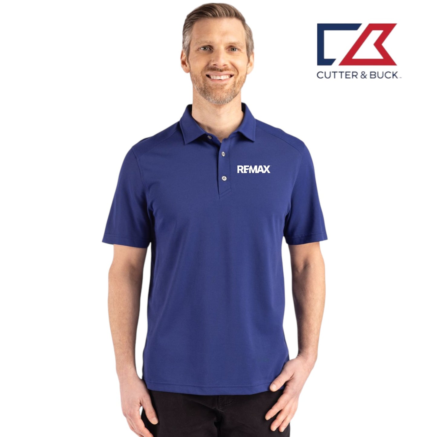 Man wearing a blue polo shirt with Remax logo, standing against a white background with Cutter & Buck logo.