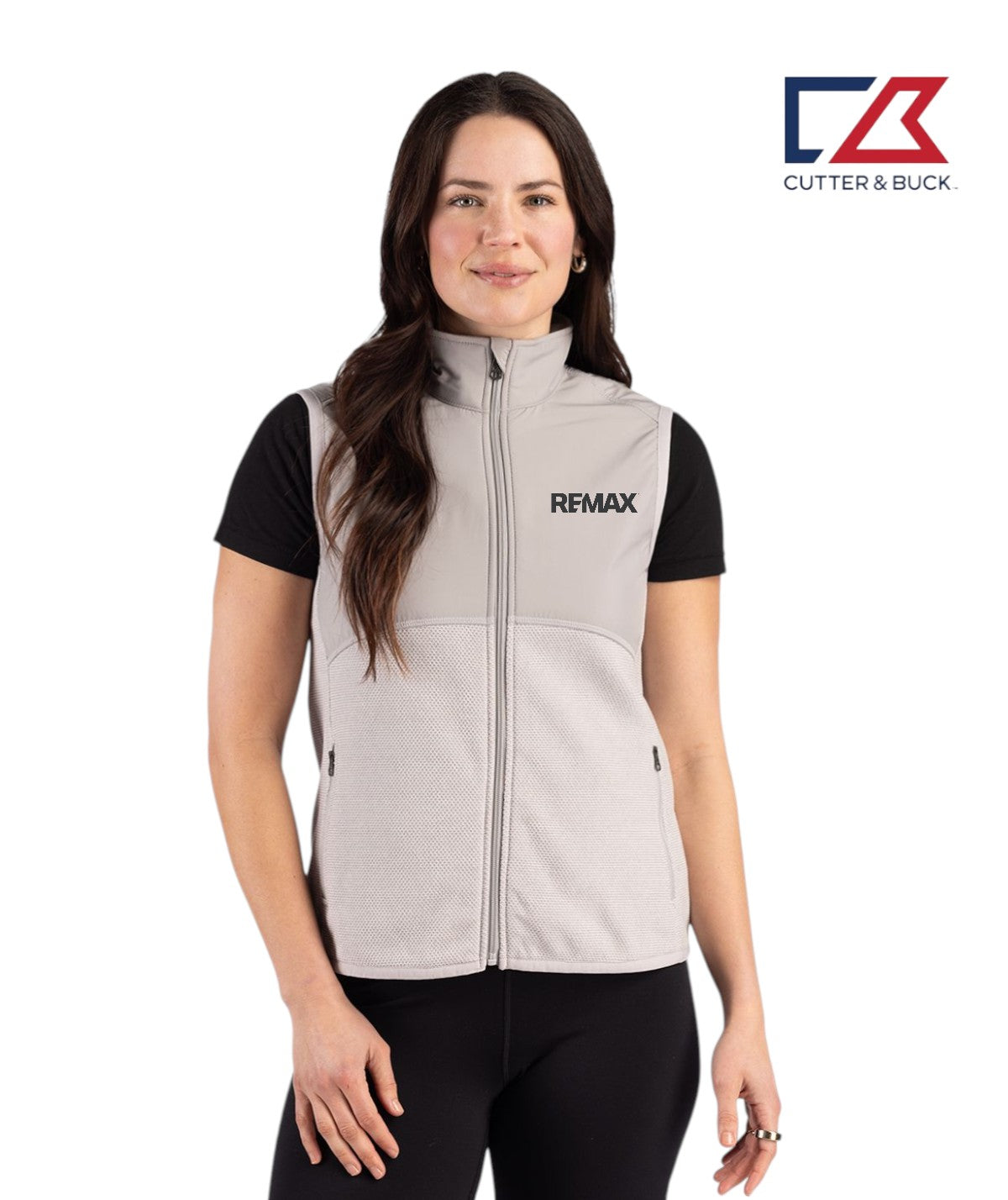 Woman wearing a gray vest with Remax logo on a white background