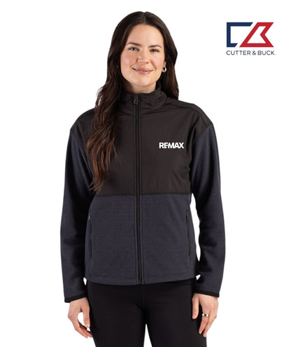 Woman wearing a black jacket with REMAX logo on a white background, featuring Cutter & Buck logo.
