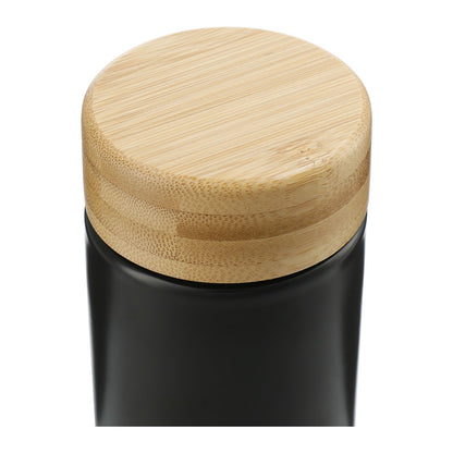 Black container with a wooden lid on a white background