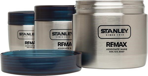 Set of Stanley insulated food jars with blue lids on a white background