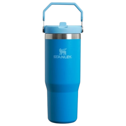 Blue Stanley tumbler with handle on a white background