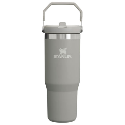 Gray Stanley tumbler with a silver lid on a white background