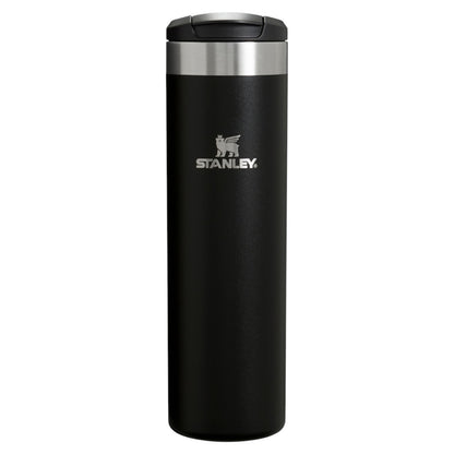 Black Stanley tumbler with a silver lid on a white background