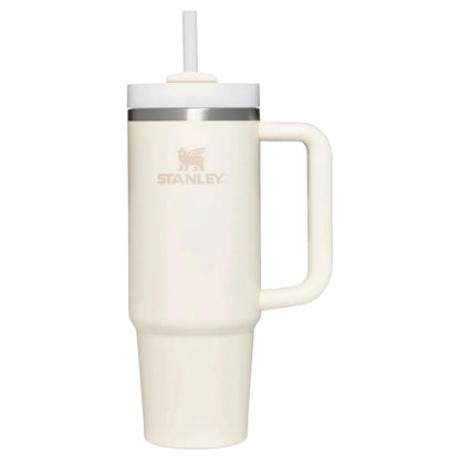 Cream-colored mug with handle and straw lid on a white background, featuring Stanley logo.